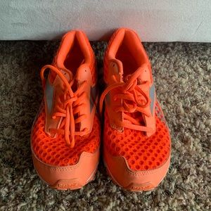 Orange Reebok sneakers